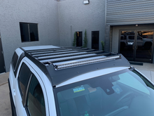 Load image into Gallery viewer, Top view of Economy Roof Rack on a white Toyota Tacoma - Cali Raised LED