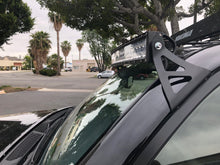Load image into Gallery viewer, Close-up of curved LED light bar and roof mounting brackets on Toyota 4Runner - Cali Raised LED